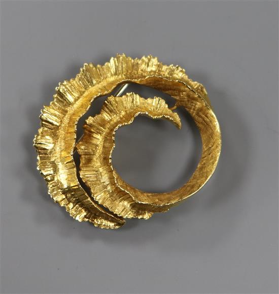 A 1970s 18ct gold brooch in the form of a coiled fern leaf, 11g, 37mm.